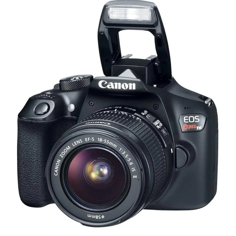 Canon Digital Camera with Interchangeable Lenses and LCD Screen with strap & bag